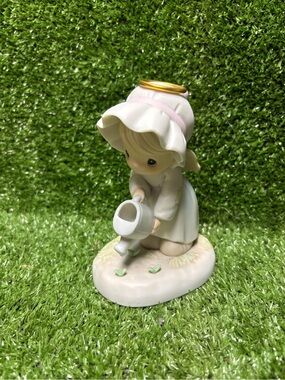 Precious Moments "Some Plant, Some Water, But God Giveth The Increase" figurine
